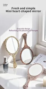 Vintage style portable handheld makeup mirror with elegant decorative gold frame