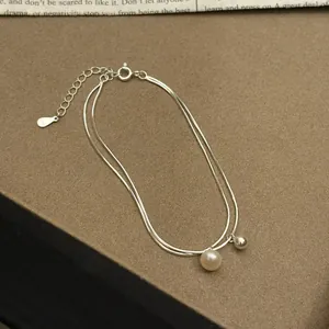 Detailed view of S925 sterling silver double-layer bracelet with a natural pearl