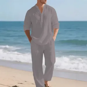 Casual men's linen two-piece set featuring long sleeve shirt and trousers on beach