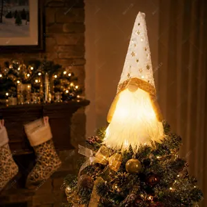 White plush LED lighted Christmas gnome tree topper featuring gold star patterns
