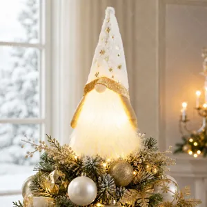 Close-up of white LED glowing gnome Christmas tree topper with gold star patterns