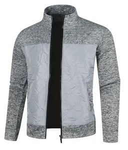 Detail view of men's grey knit cardigan jacket featuring a quilted nylon front panel