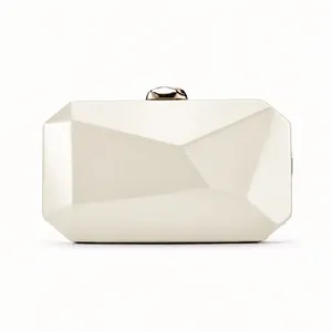 Detailed view of elegant ivory geometric faceted evening clutch bag with gold clasp