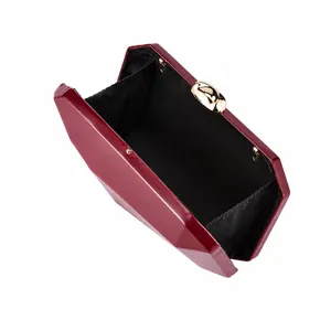 Close-up interior detail of an elegant burgundy PU geometric evening clutch bag