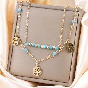 Élégant collier bohème double épaisseur plaqué or avec pendentif arbre de vie et perles