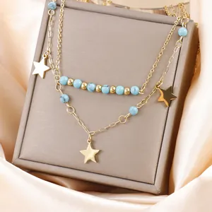 Élégant collier multi-rangs plaqué or avec perles turquoise et pendentifs en forme d'étoile