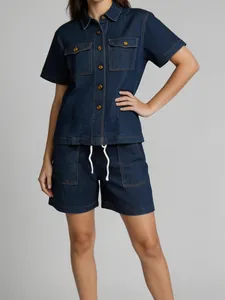 Close-up of vintage loose denim set with retro metal buttons and drawstring shorts