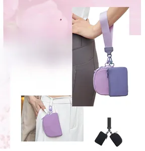 Detailed view of a versatile 2-in-1 purple wristlet pouch with a detachable mini card holder
