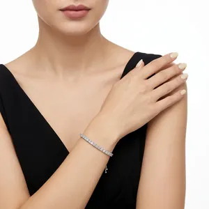 Elegant 925 silver moissanite tennis bracelet worn by a woman on white background
