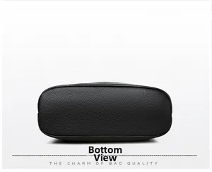 Vista inferior detallada de un bolso bandolera de cuero genuino negro grano litchi