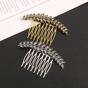 Detailed view of alloy leaf hair combs with sparkling rhinestones in gold and silver
