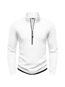 Detailed view of white long-sleeved knitted sweater featuring half-zip stand collar