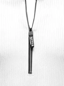 Detailed view of the black zipper puller on a premium white textured men's knitwear sweater