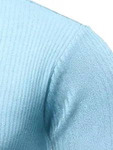 Close-up detail of light blue ribbed knit texture on men's sweater shoulder