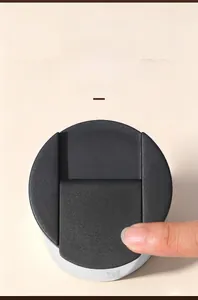 Close-up of the one-click lock buckle on a stainless steel coffee mug lid