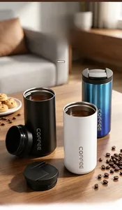 Detail view of colorful stainless steel insulated coffee tumblers on a wooden table