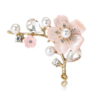 Elegant pink cherry blossom brooch with alloy rhinestones and pearls on gold branch