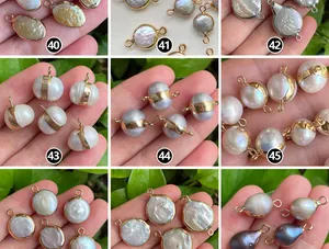 Detailed macro view of assorted baroque pearls with gold-plated edges for DIY jewelry making.