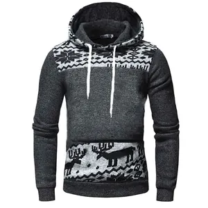 Detailed macro view of a grey men's hoodie featuring Christmas elk and snowflake patterns