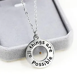 Mustard seed necklace with 'all things are possible' engraving on stainless steel circle