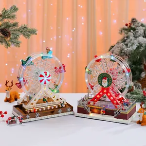 Detailed view of glowing and rotating Christmas Ferris wheel music boxes with LED lights