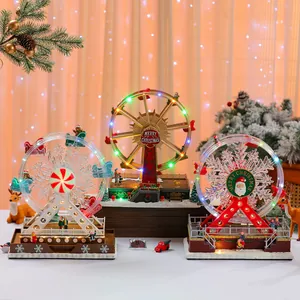 Detail view of three rotating light-up Christmas Ferris wheel music boxes for gift