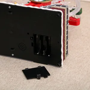 Macro view of the battery compartment on a festive Christmas musical ferris wheel