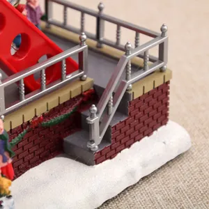 Close-up of miniature stairs and railing detail on Christmas ferris wheel music box