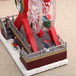 Close-up of a rotating Christmas ferris wheel music box with festive figurines
