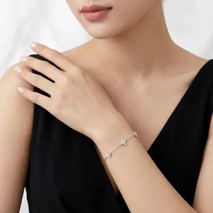 Elegant S925 sterling silver moissanite four-leaf clover charm bracelet shown on model