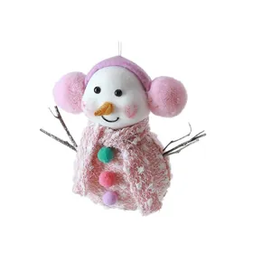 Adorable pink plush snowman Christmas ornament with earmuffs and a dotted scarf