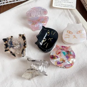 Collection of cute cat-shaped acetate hair claw clips in various marbled colors