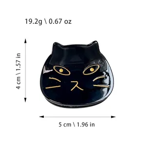 Elegant black acetate cat hair claw clip with gold facial details, 5cm width size