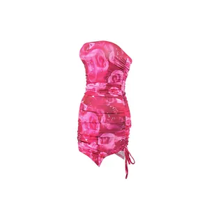 Detail of a pink rose print tube top bodycon mini dress with ruched side slit