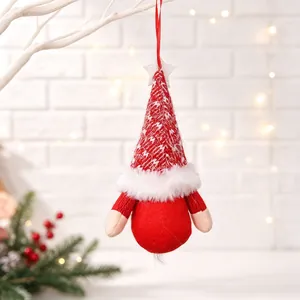 Handmade red and white knitted Christmas gnome plush ornament with a star detail.