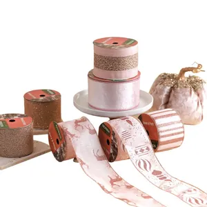 Pink and rose gold decorative Christmas ribbons with reindeer and glitter patterns