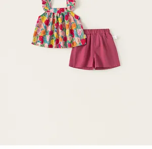 Detailed view of girls floral ruffle doll shirt and solid shorts summer outfit set