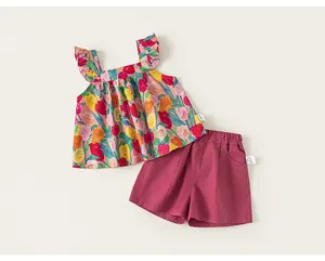 Detailed view of cute toddler girl floral sleeveless ruffle top and magenta shorts set