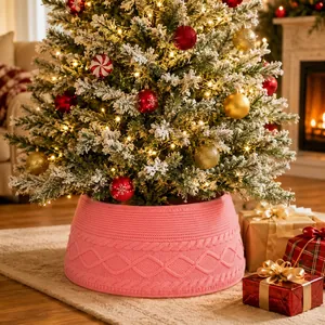 Pink knitted Christmas tree collar with elegant cable knit pattern for holiday home decor