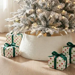 Cream white woven Christmas tree collar shown under a frosted tree with warm lights