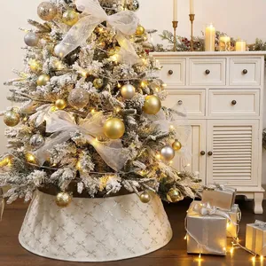 Detail view of cream Christmas tree skirt with sequin diamond pattern and warm lighting