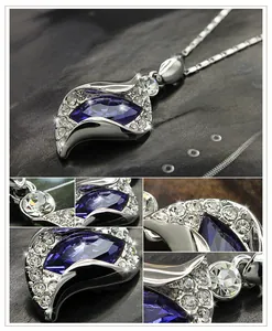 Macro detail of marquise sapphire crystal pendant with micro-pave cubic zirconia accents