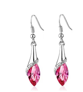 Detailed view of pink marquise crystal earrings with silver-tone metal and white accents