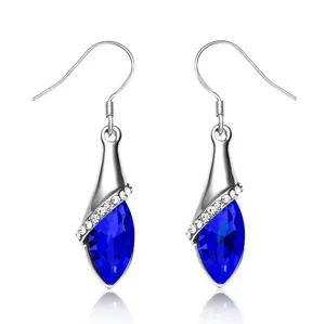 Detailed macro of S925 sterling silver hook earrings with blue marquise crystal