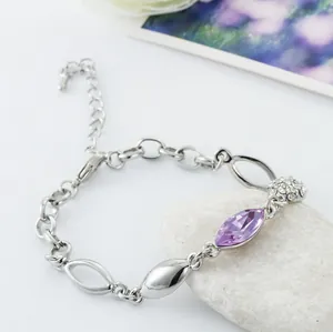 Detail of silver alloy bracelet with purple marquise crystal and pavé sphere charm