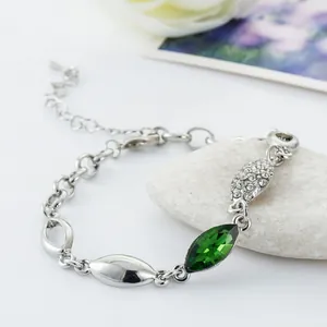 Silver-tone bracelet with green marquise crystal and zircon stones on white stones