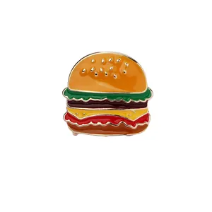 Macro shot of colorful enamel hamburger brooch pin with detailed burger layers