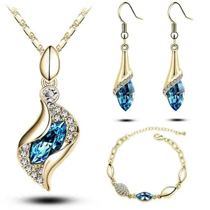 Exquisite gold jewelry set with navy blue marquise crystals and sparkling white accents