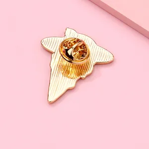 Detail view of the metal brooch back with gold finish and butterfly clutch pin
