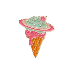 Detail of creative enamel planet ice cream brooch with golden stars and moon patterns